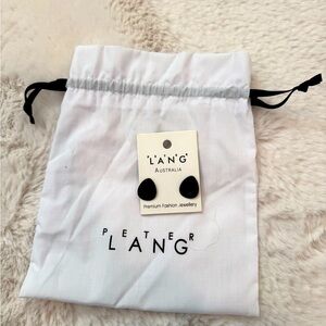 Contemporary black fashion ear studs